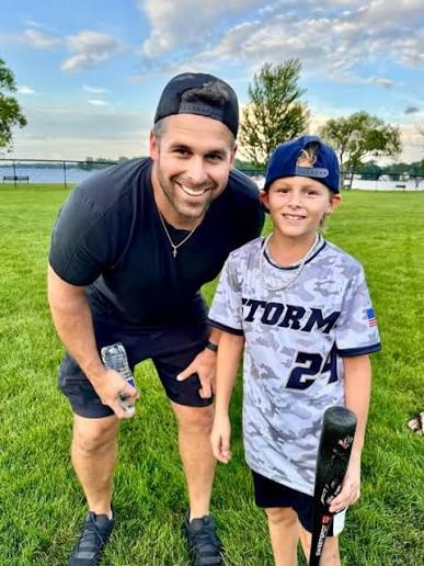Nate Hanson with his son Easton in a Storm jersey